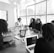 people sitting beside rectangular table beside window